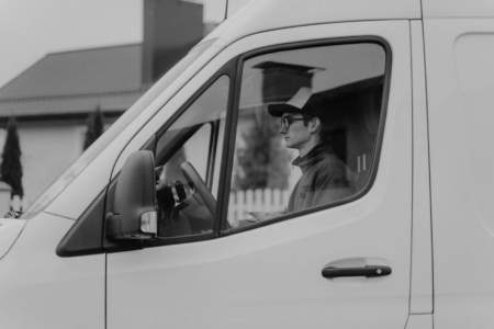 A delivery driver focused on the road.